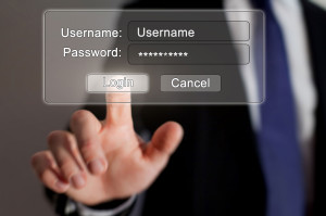 An image of a digital login screen with a person in the background touching the login button.
