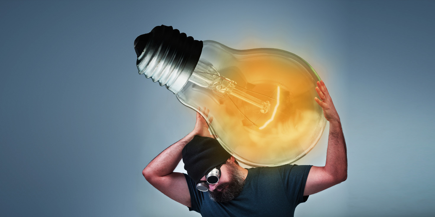 man carrying his idea lightbulb